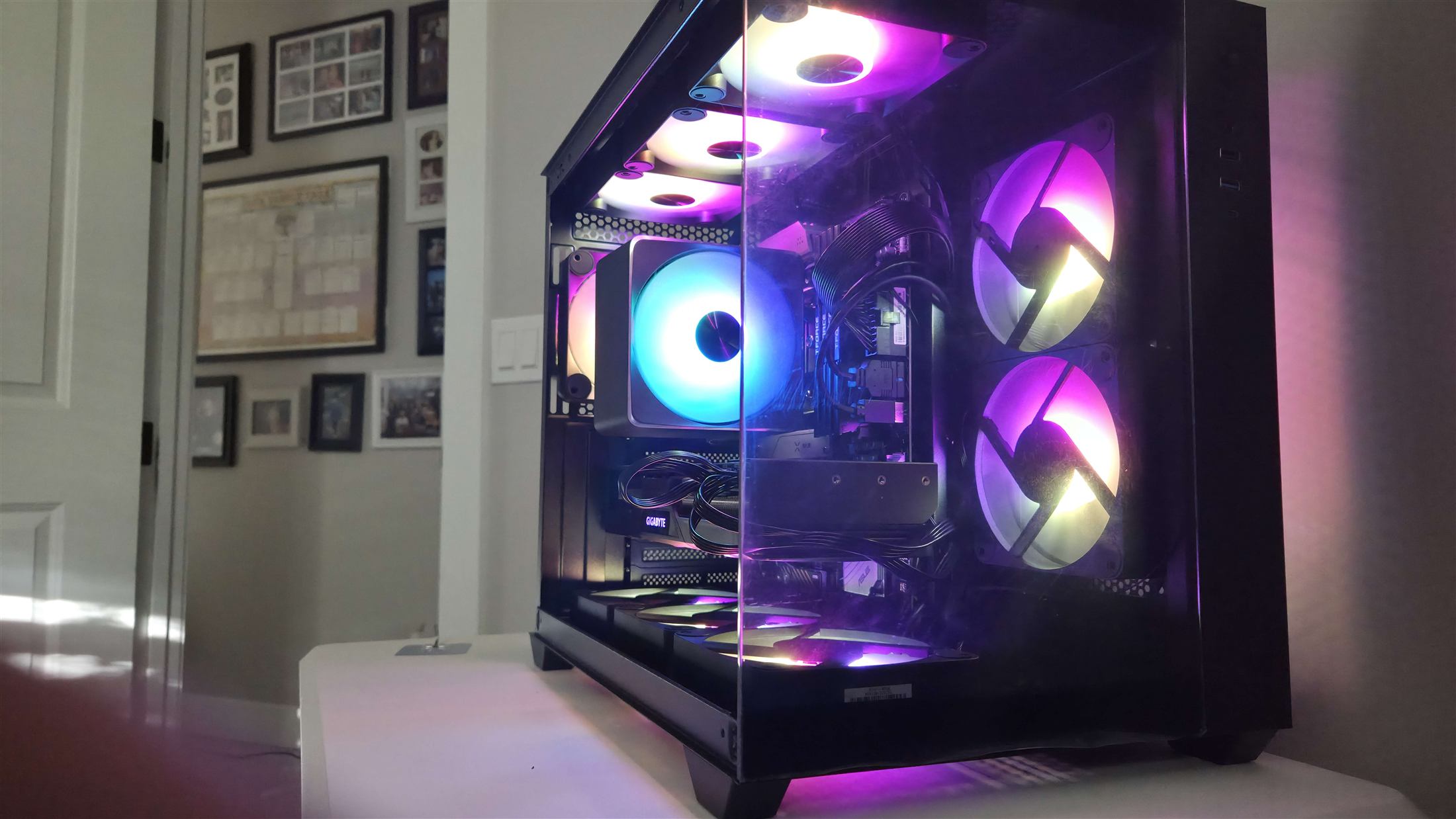 Custom gaming PC with purple RGB fans and panoramic glass case